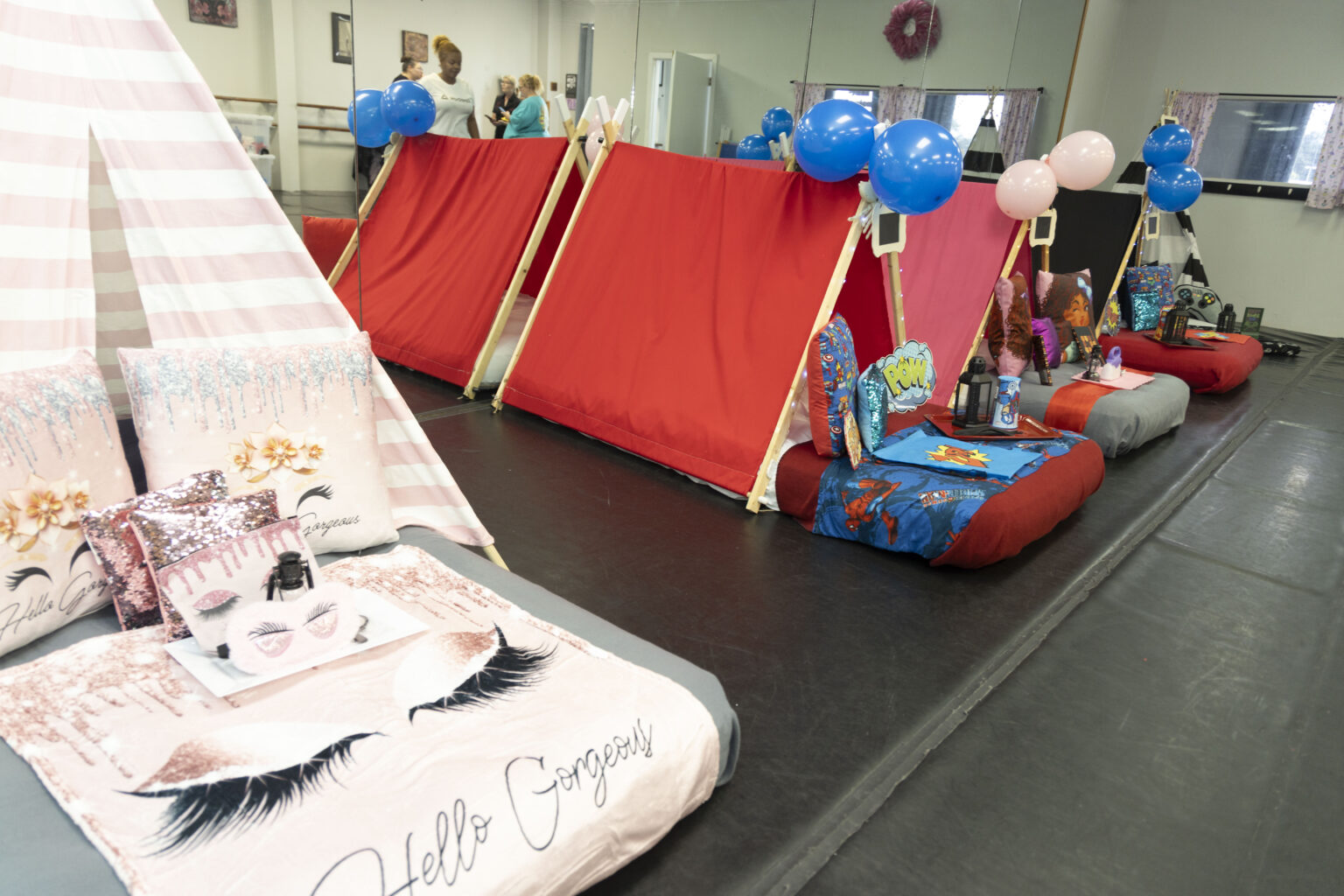 Children's sleepover party with fairy lights and decorative pillows